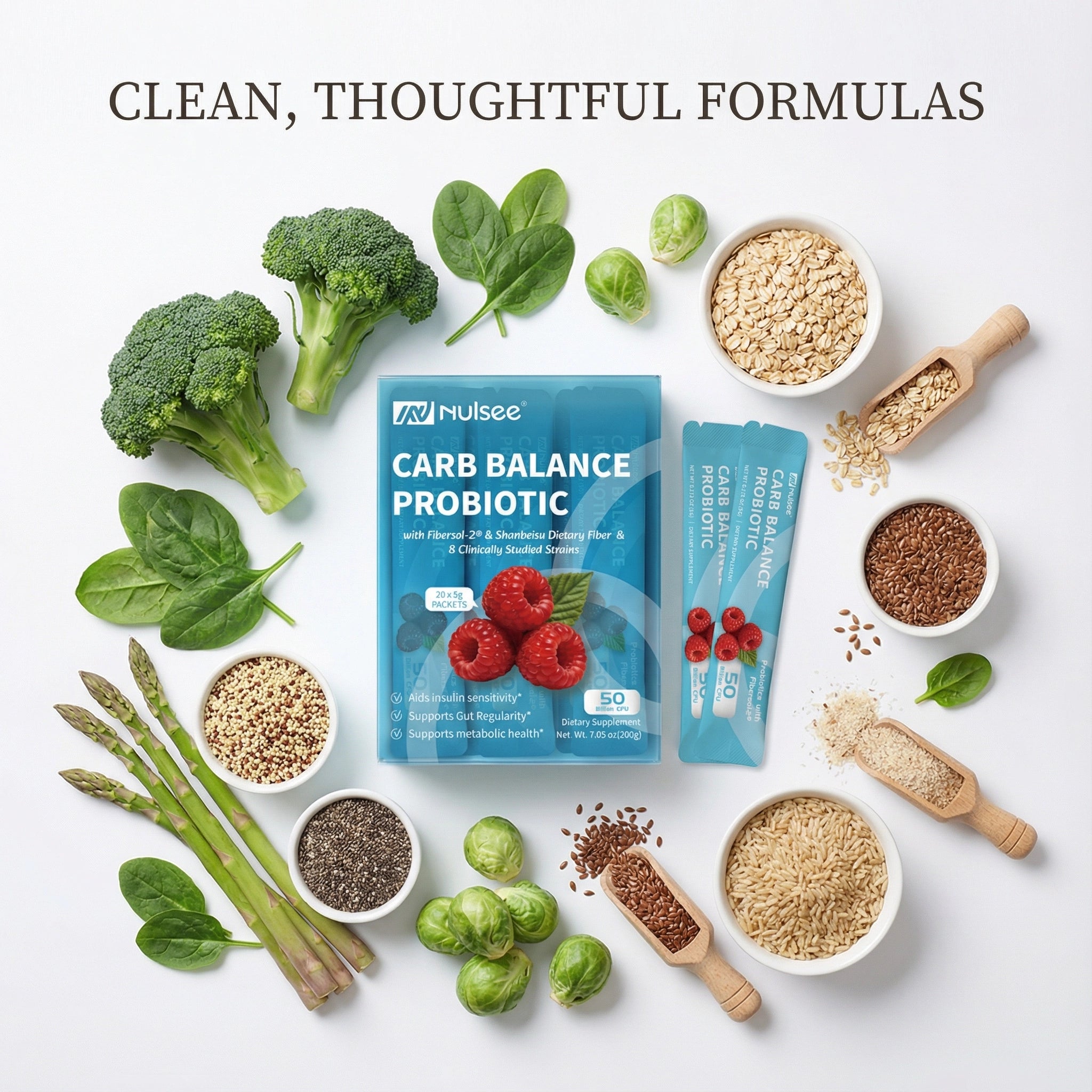 Nulsee Carb Balance Probiotic packets surrounded by fresh fiber-rich vegetables and grains on white background, emphasizing clean and simple ingredients