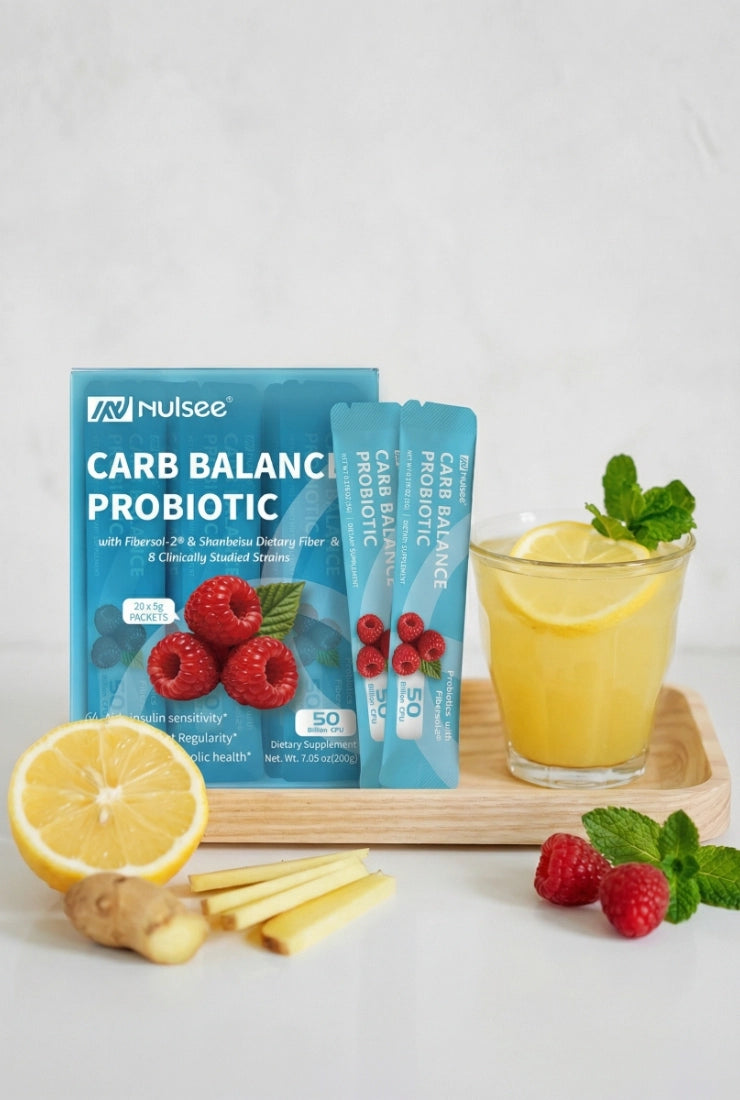 Vertical composition of Nulsee Carb Balance Probiotic product on wooden tray with refreshing beverage garnished with mint, lemon and ginger for social media and mobile display